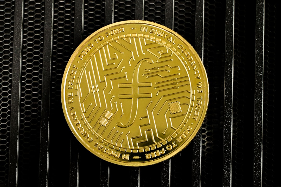 a close up of a gold coin on a black background