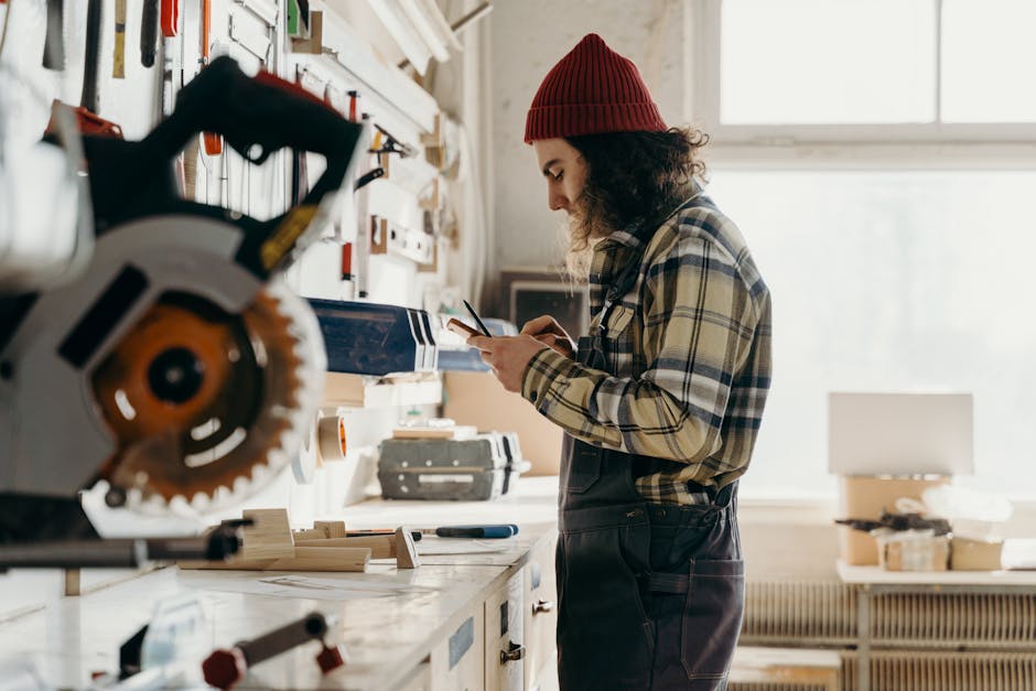 A focused woodworker in an indoor workshop, engaged in craftwork with tools at hand.