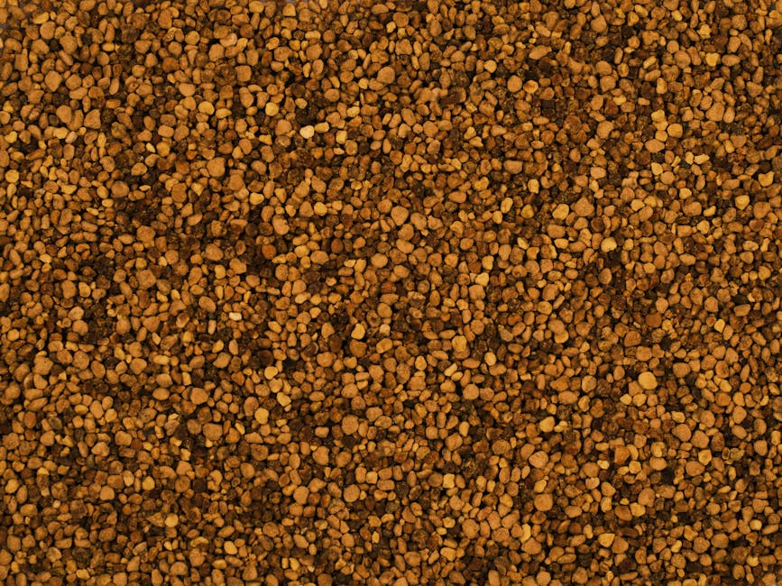 Close-up image of raw organic bee pollen granules with a natural texture.