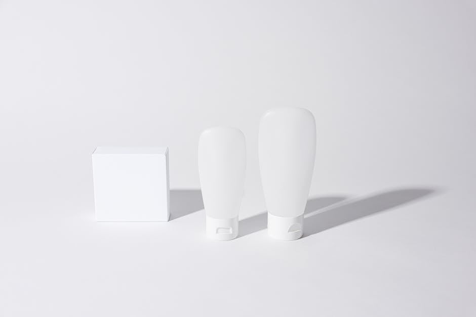 Minimalist white cosmetic containers with shadows, perfect for product mockups and ad designs.