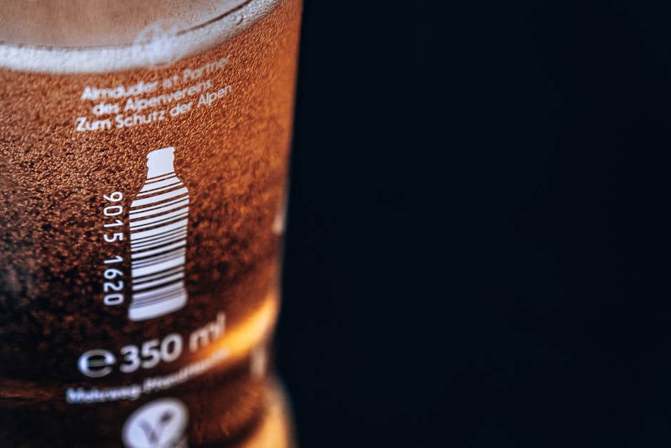 Detailed close-up of a frosted drink bottle showcasing a barcode and 350ml capacity.