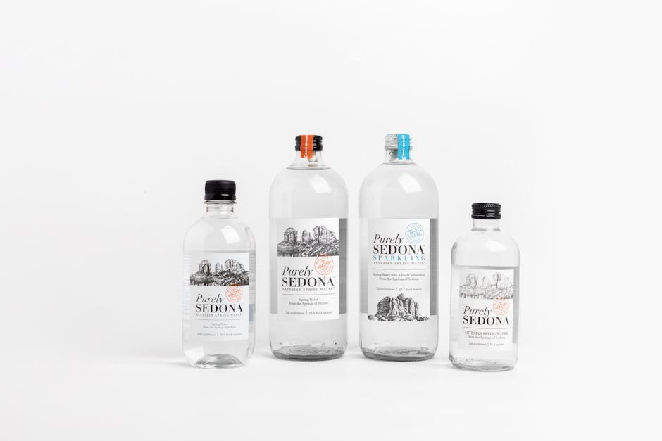 Studio shot of Purely Sedona water bottles in various sizes on a white background.